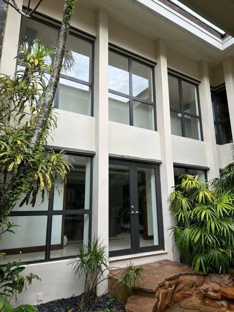 Home exterior with hurricane impact windows in Miami area
